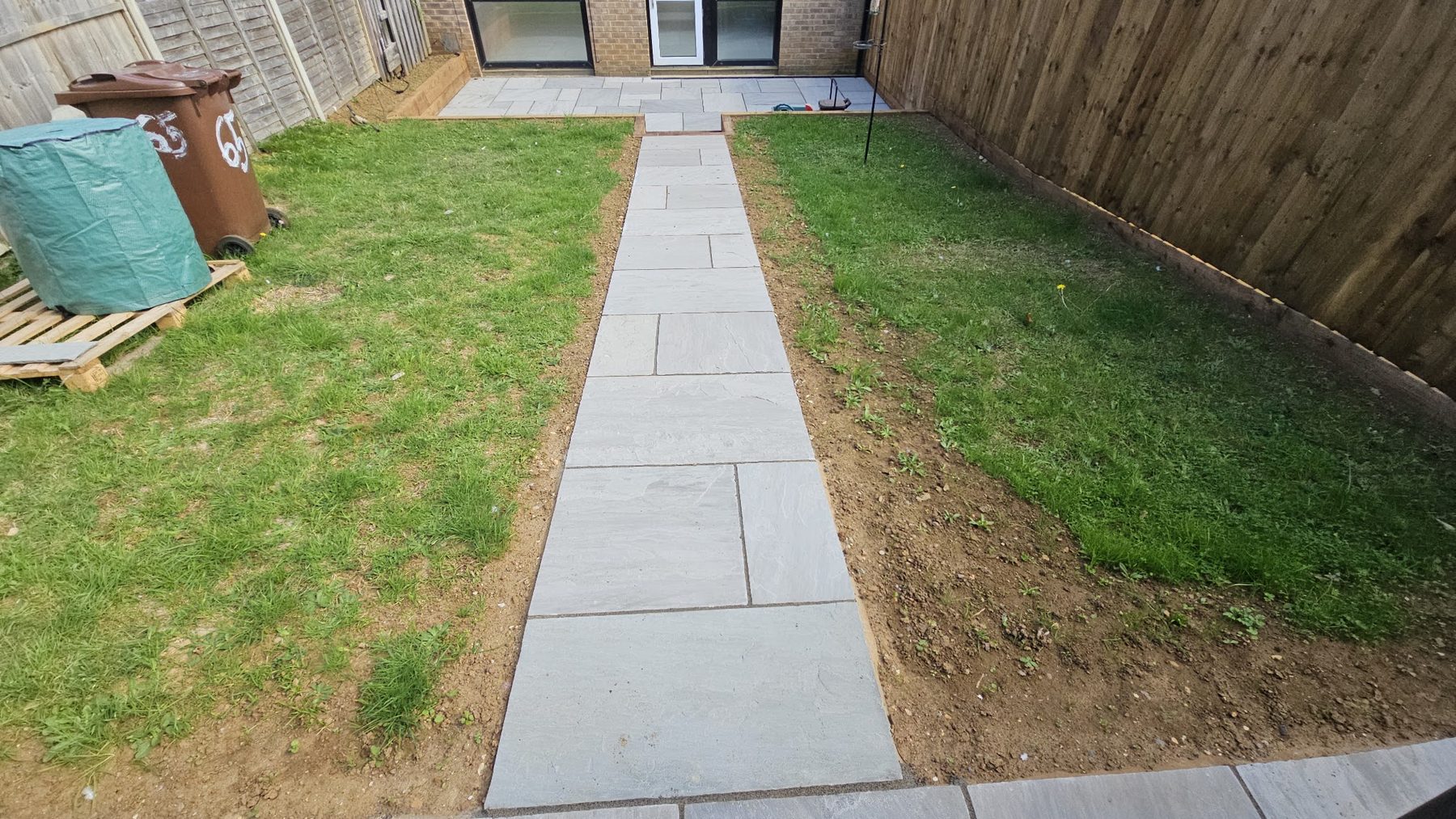 Finished garden path in sandstone paving