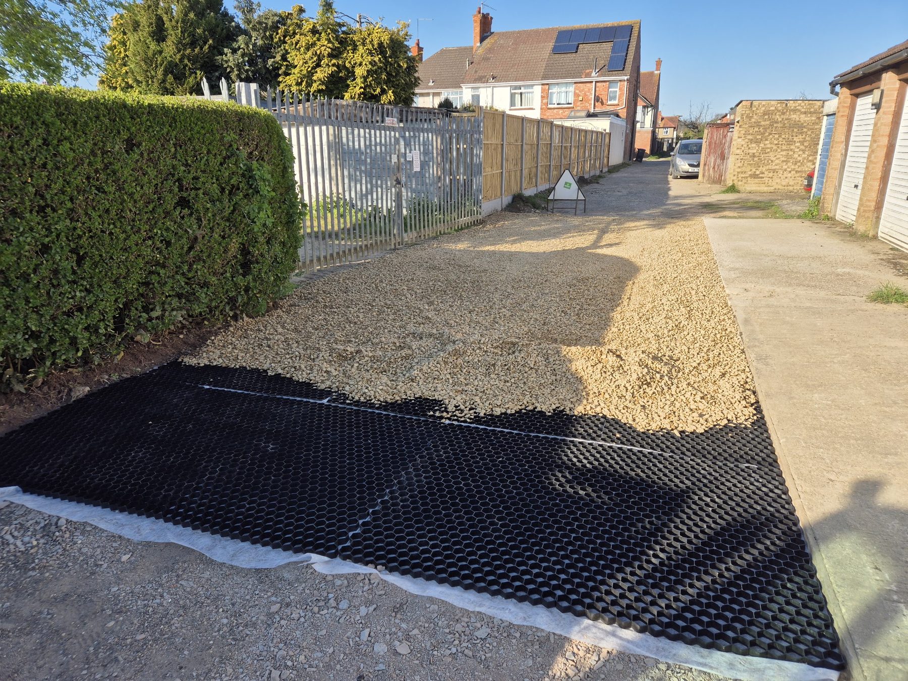 Permeable grid and gravel driveway installation in progress